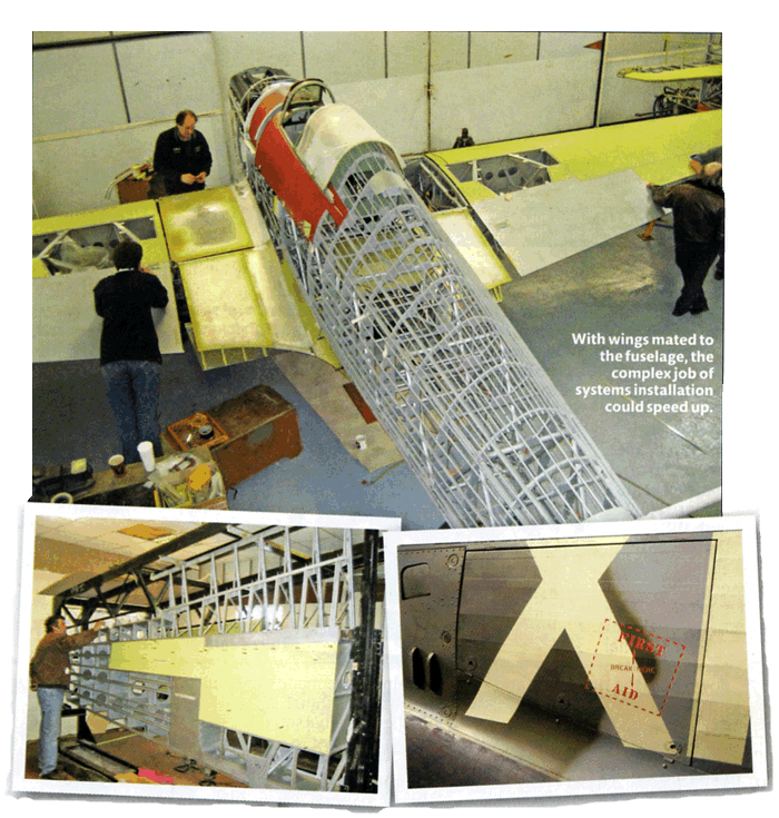  Hangar 11's Chief Engineer Chris Norris examining the port wing as skinning gets under way in March 2008. Detailed stencilling on the fuselage.